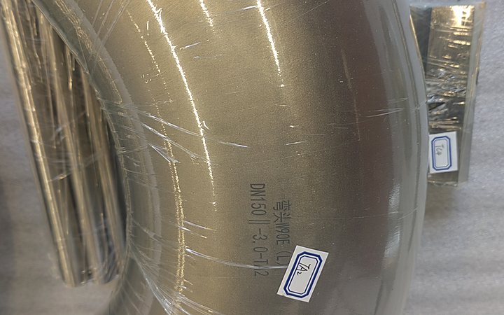Alloy elbow undergoing dimensional verification