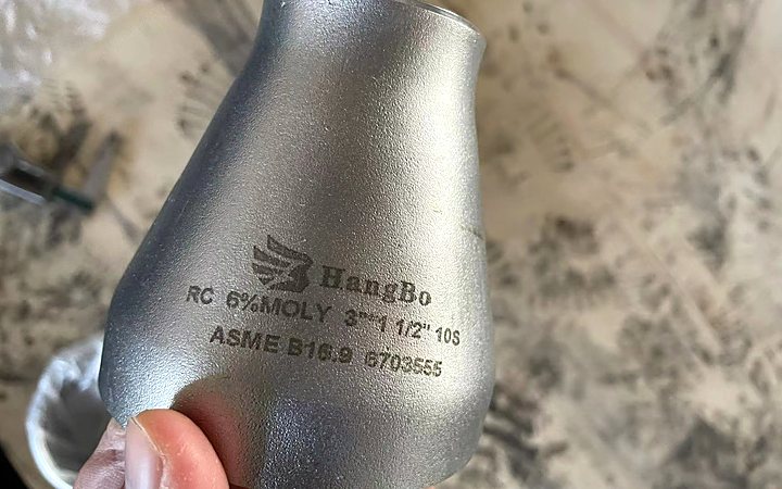 Alloy elbow showing stencil marking on the outside surface