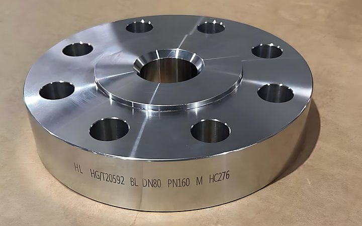Nickel alloy flange on a machining bench with finished sealing face and hub