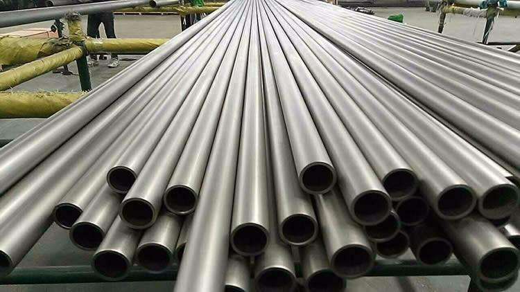 Bundles of pickled seamless nickel alloy tubes stacked on a rack